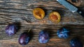 Italian plums on wooden background
