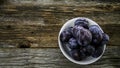 Italian plums on wooden background Royalty Free Stock Photo