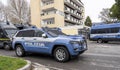 Italian police car in action in the streets of the city. Police car with riot protection. Jeep Grand Cherokee model car