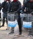 Italian police officers in riot gear with the word POLIZIA meani