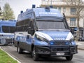 Italian police van in action in the streets of the city. Police van with riot protection