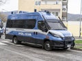 Italian police van in action in the streets of the city. Police van with riot protection