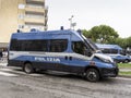 Italian police van in action in the streets of the city. Police van with riot protection