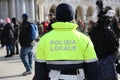 italian cop with uniform with the text POLIZIA LOCALE which mean Royalty Free Stock Photo