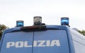 Italian POLIZIA van with large text POLIZIA and flashing sirens