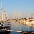 Italian port with little yachts and ferris wheel