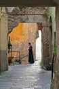 Italian Priest in small streets
