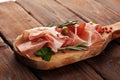 Italian prosciutto crudo or jamon with rosemary. Raw ham with spices