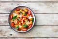 Italian ravioli with cherry tomatoes, spinach, tomato sauce and parmesan cheese Royalty Free Stock Photo