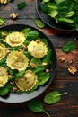 Italian ravioli pasta stuffed with spinach, creamy ricotta cheese, walnuts. Healthy Vegetarian food Royalty Free Stock Photo