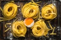 Italian raw homemade pasta tagliatelle. Royalty Free Stock Photo
