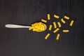 italian raw pasta spiral fusilli dry on a metallic spoon and an black table Royalty Free Stock Photo