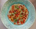 Italian red prawns carpaccio in a green plate, shrimps known as gambero rosso