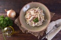 Italian regional dish made of pasta with ingredient such as oil, onion, nepskin on wooden table with sackcloth.