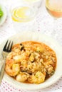 Italian rice dish risotto with seafood, shrimps and mussels