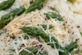 Italian risotto with spring asparagus and grated cheese closeup selective focus Royalty Free Stock Photo