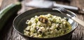 Italian risotto zucchini mushrooms and parmesan in dark plate Royalty Free Stock Photo