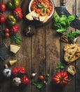 Italian roasted tomato and garlic soup with bread, basil, parmesan Royalty Free Stock Photo