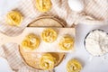 Italian rolled fresh fettuccine pasta with flour on white background Royalty Free Stock Photo