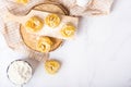 Italian rolled fresh fettuccine pasta with flour on white background Royalty Free Stock Photo