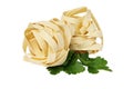 Italian rolled fresh fettuccine pasta with parsley isolated on white Royalty Free Stock Photo