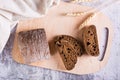 Italian rye ciabatta bread sliced on a wooden board on the table. Top view Royalty Free Stock Photo