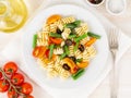 Italian salad with fusilli paste tomatoes, olives, green beans, top view, close up Royalty Free Stock Photo