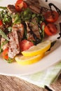 Italian salad of grilled beef with arugula and tomatoes macro. v