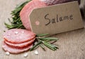 Italian salami sausage slices with rosemary and sea salt Royalty Free Stock Photo