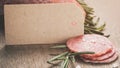 Italian salami sausage slices with rosemary and sea salt Royalty Free Stock Photo