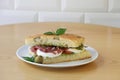 Italian sandwich Focaccia with mozzarella cheese olives and ham