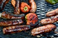 Italian Sausage or Bratwurst and Peppers on the Grill Royalty Free Stock Photo