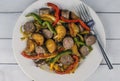 Italian sausage with red roasted potatoes and peppers and onions Royalty Free Stock Photo