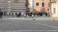 Italian schoolboys and schoolgirls in a schooltrip playing foot in the Cathedral square