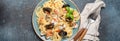 Italian seafood pasta spaghetti with mussels, shrimps, clams in tomato sauce with green basil on plate on rustic blue Royalty Free Stock Photo