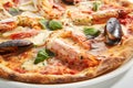 Italian Seafood Pizza with Squid, Mussels and Shrimps Royalty Free Stock Photo