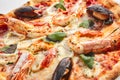 Italian Seafood Pizza with Squid, Mussels and Shrimps Royalty Free Stock Photo