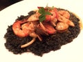 Italian Seafood tomato based squid ink risotto rice