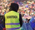 Security guard during the event with text ASSISTENZA that means Royalty Free Stock Photo