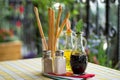 Italian serving table set of olive oil, bread sticks, salt, pepper, soy sauce, vinegar Royalty Free Stock Photo