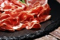 Italian sliced cured coppa with spices. Raw ham. Crudo or jamon with rosemary Royalty Free Stock Photo