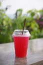 Italian soda with lime in plastic glass. Royalty Free Stock Photo