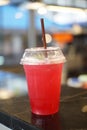 Italian soda with lime in plastic glass. Royalty Free Stock Photo