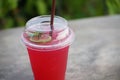 Italian soda with lime in plastic glass. Royalty Free Stock Photo