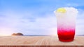 Italian soda made from fruit syrup drink mix in plastic cup on wooden table. Lemon, Red cocktail summer refreshment drink, Summer Royalty Free Stock Photo