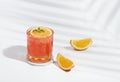 Italian soda strawberry orange on pastel color background. Exotic summer drinks Royalty Free Stock Photo