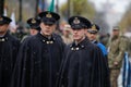 Italian soldiers in ceremonial uniforms take part at the Romanian National Day military parade during a snowy day