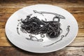 Italian spaghetti al nero di seppia, Black pasta squid ink Royalty Free Stock Photo