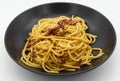 Italian Spaghetti alla Carbonara Pasta in a black dish isolated on white Royalty Free Stock Photo