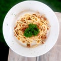 Italian spaghetti Bolognaise or Bolognese with a tomato sauce topped with grated parmesan bd fresh basil leaves in a close up view Royalty Free Stock Photo